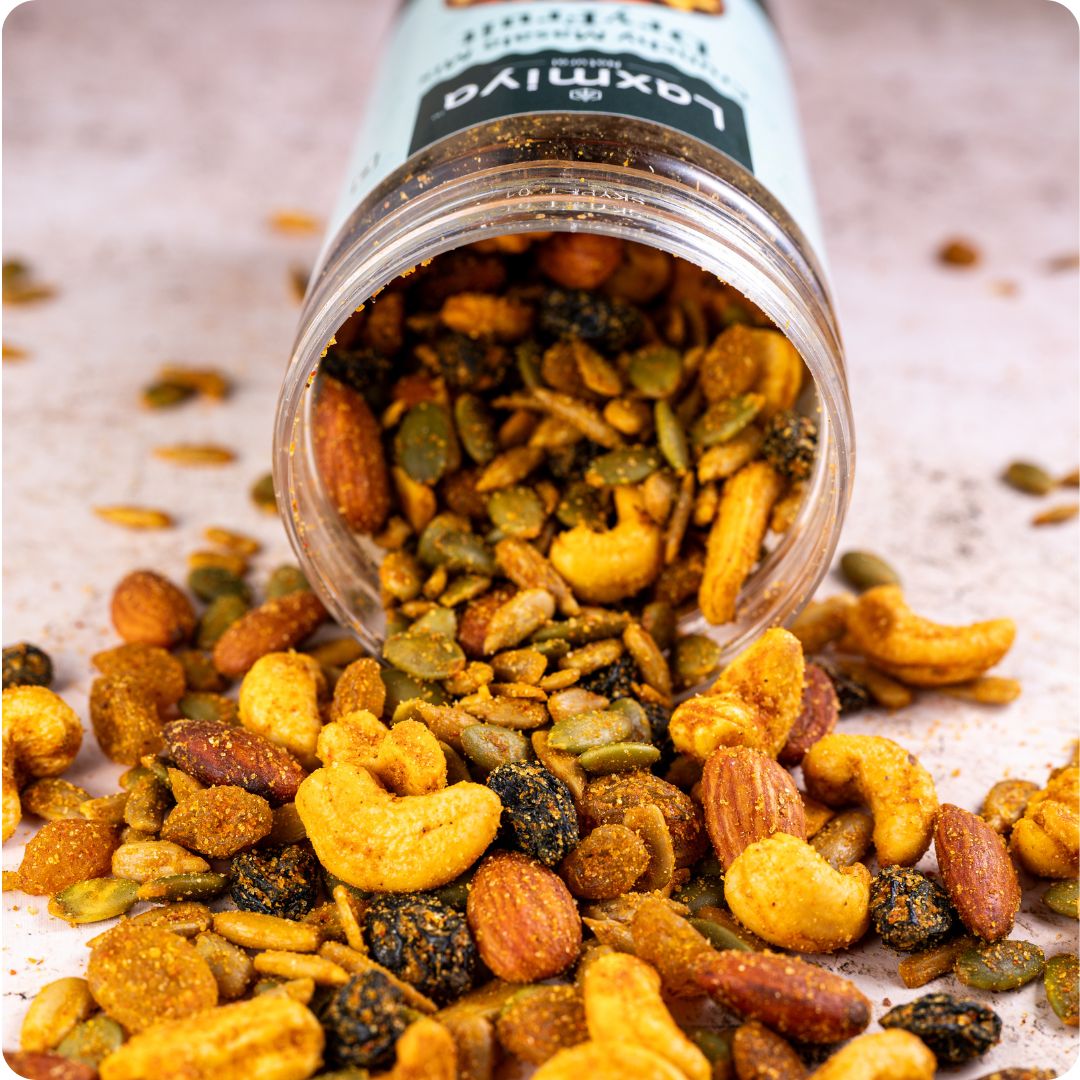 Healthy dry fruit snack mix jar with almonds, cashews, raisins and seeds